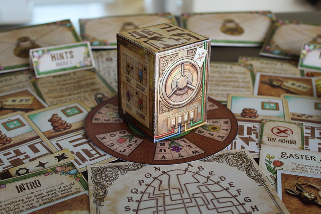 Close-up of Puzzle 1 from The Easter Vault: four chocolate bunny illustration cards showing stages from whole to fully eaten, plus a square decoder piece with cut-out windows. Easter escape room puzzle for kids. Decode hidden four-letter words to reveal a 4-digit code. Fun Easter brain teaser.