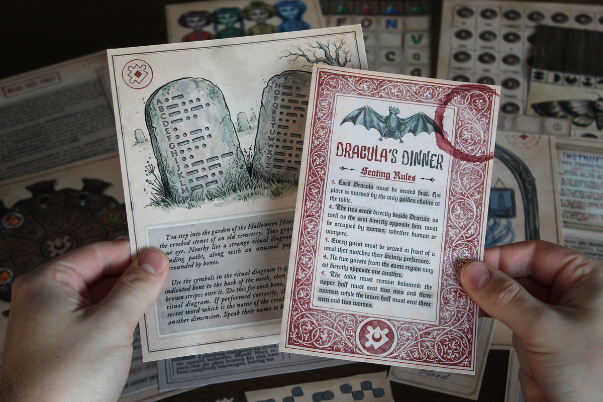 Player holding the cemetery gravestone puzzle and Dracula’s Dinner seating rules from The Halloween House printable escape room for adults and teens. The surrounding table is filled with haunted dolls, coded letters, potion instructions, Bloody Mary’s mirror, and Halloween puzzle components. This DIY escape room combines cemetery rituals, Morse code, vampire logic, word puzzles, folding mechanics, deduction, and hands-on paper challenges in one immersive spooky adventure at home.