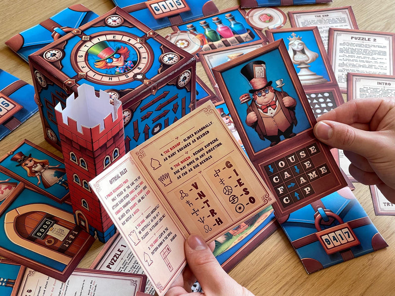 Escape room printable game in progress with players decoding symbols, opening envelopes, and manipulating a foldable cube. 6 interconnected puzzles designed for a 60-minute Wonderland-themed challenge.