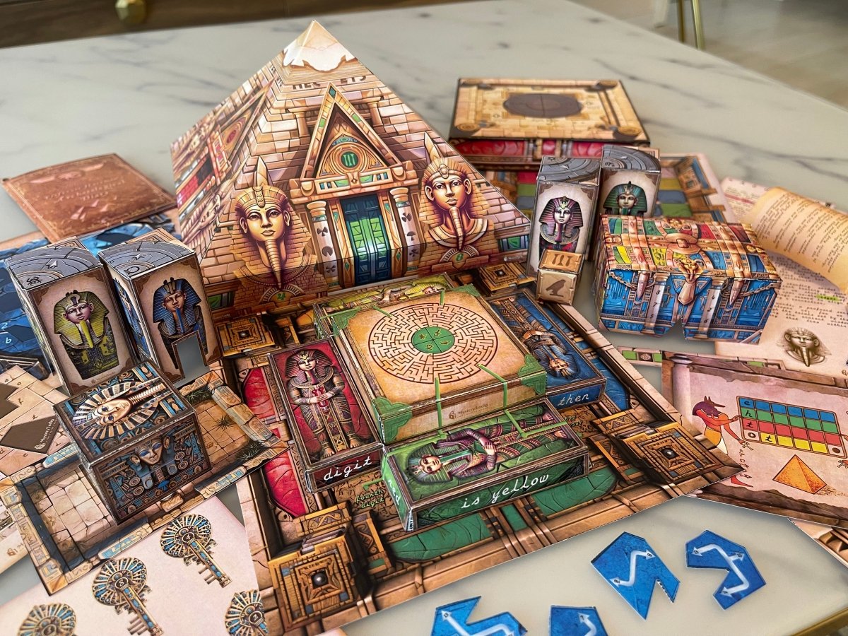 The printable escape room features visually stunning game materials that include a paper pyramid, canopic jars, mazes, pharaoh tombs, keys, story cards, and puzzle pieces. Solve the escape room puzzles and escape The Pyramid!
