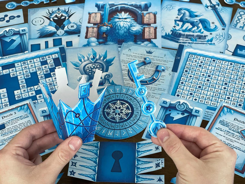 Hands assembling 3D paper props from The Snow Queen printable escape room by MysteryLocks. The winter DIY escape room kit includes icy blue puzzles, story cards, ciphers, a paper crown, and a magical key used to unlock clues. Ideal for families, teachers, and escape room fans, this at-home printable game transforms any space into a frozen adventure filled with riddles, codes, and creative hands-on challenges inspired by the Snow Queen legend.