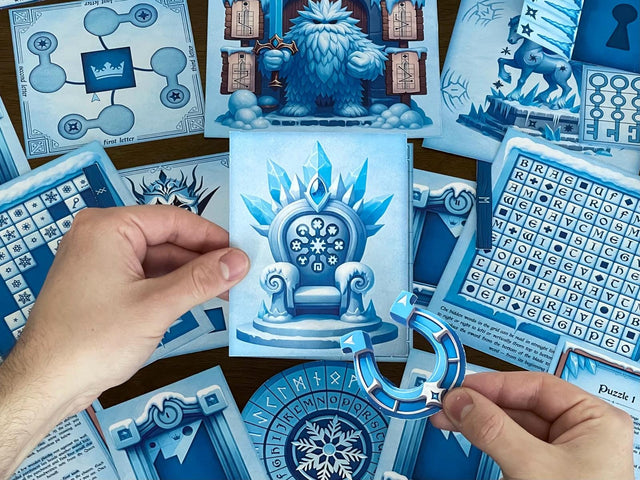 Hands holding illustrated puzzle pieces — an icy throne card and a blue horseshoe — from The Snow Queen printable escape room by MysteryLocks. Surrounding the pieces are winter-themed logic puzzles, cipher wheels, and word grids. This DIY escape room game transforms your home into a magical frozen realm filled with codes, clues, and storytelling. Ideal for families, teachers, or puzzle lovers seeking a creative, printable winter escape room adventure.
