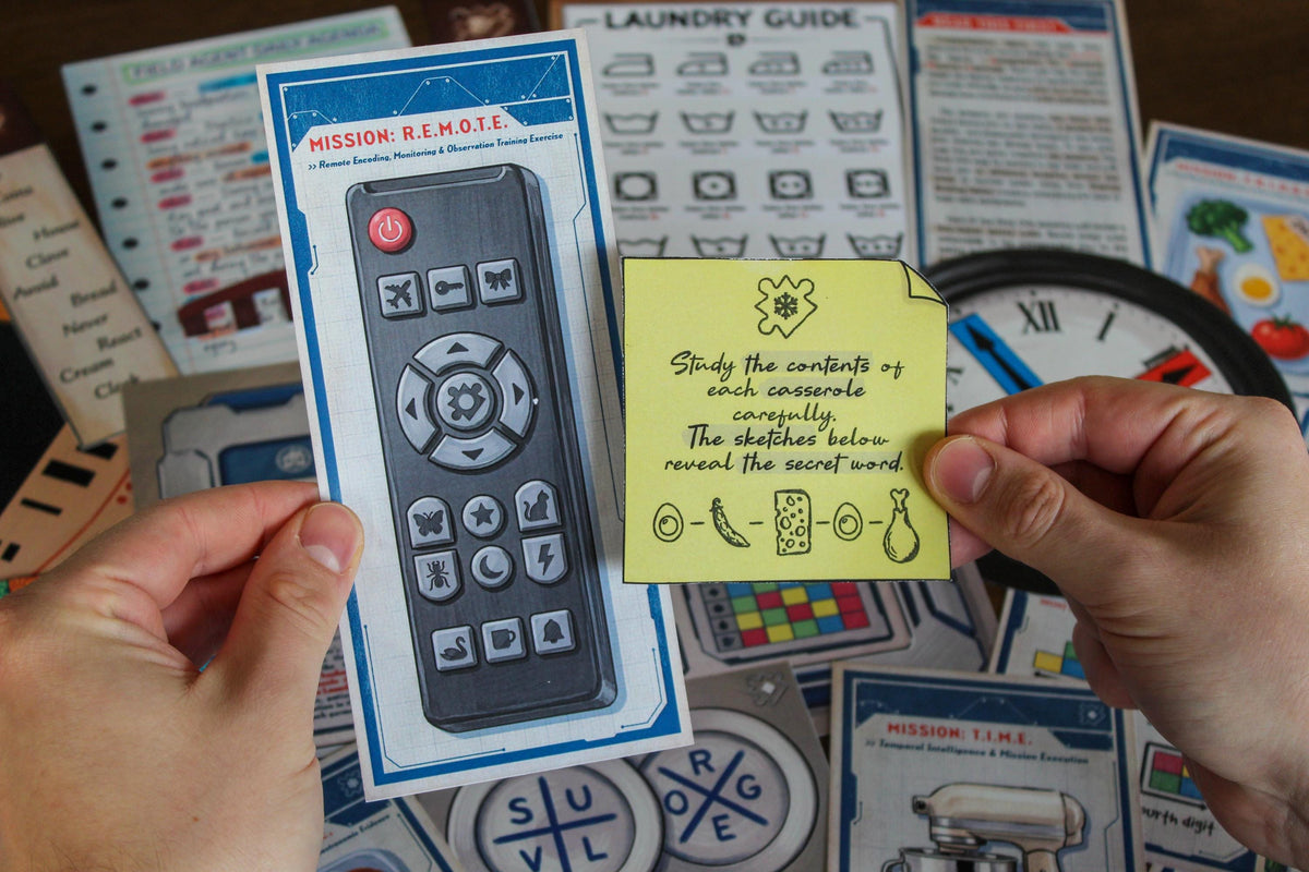 Player holding the R.E.M.O.T.E. mission card and a food evidence clue from Your Home Is an Escape Room, a printable spy game for kids and teens. The table is filled with agent briefing materials, laundry symbols, a clock puzzle, coded bookmarks, and other interactive clues. This DIY escape room at home sends players searching through familiar household locations while solving five different secret-agent missions and one final escape challenge.