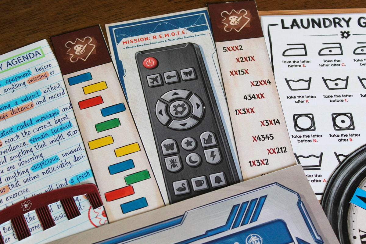 Detailed R.E.M.O.T.E. mission materials from Your Home Is an Escape Room, including a printable remote control, coded color strips, agent agenda, laundry symbols, and hidden-message clues. This DIY printable escape room for kids and teens turns the television area and front-door doormat into part of a secret spy training challenge. Players decode words, follow symbol sequences, search around their real home, and uncover secret answers through interactive puzzle solving.